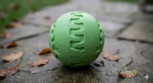 A size guide comparing small and large glow in the dark dog balls next to a standard tennis ball.
