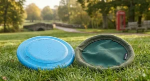 A clear comparison diagram showing a red hard frisbee for dogs placed next to a flexible fabric flyer.